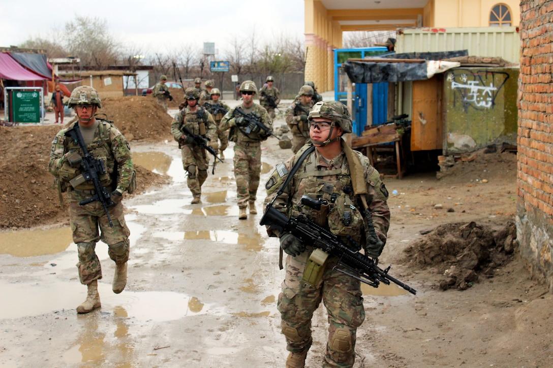 U.S. soldiers conduct a patrol through a village near Bagram Airfield, Afghanistan, March 24, 2015. The soldiers are assigned to 101st Airborne Division's 3rd Battalion, 187th Infantry.