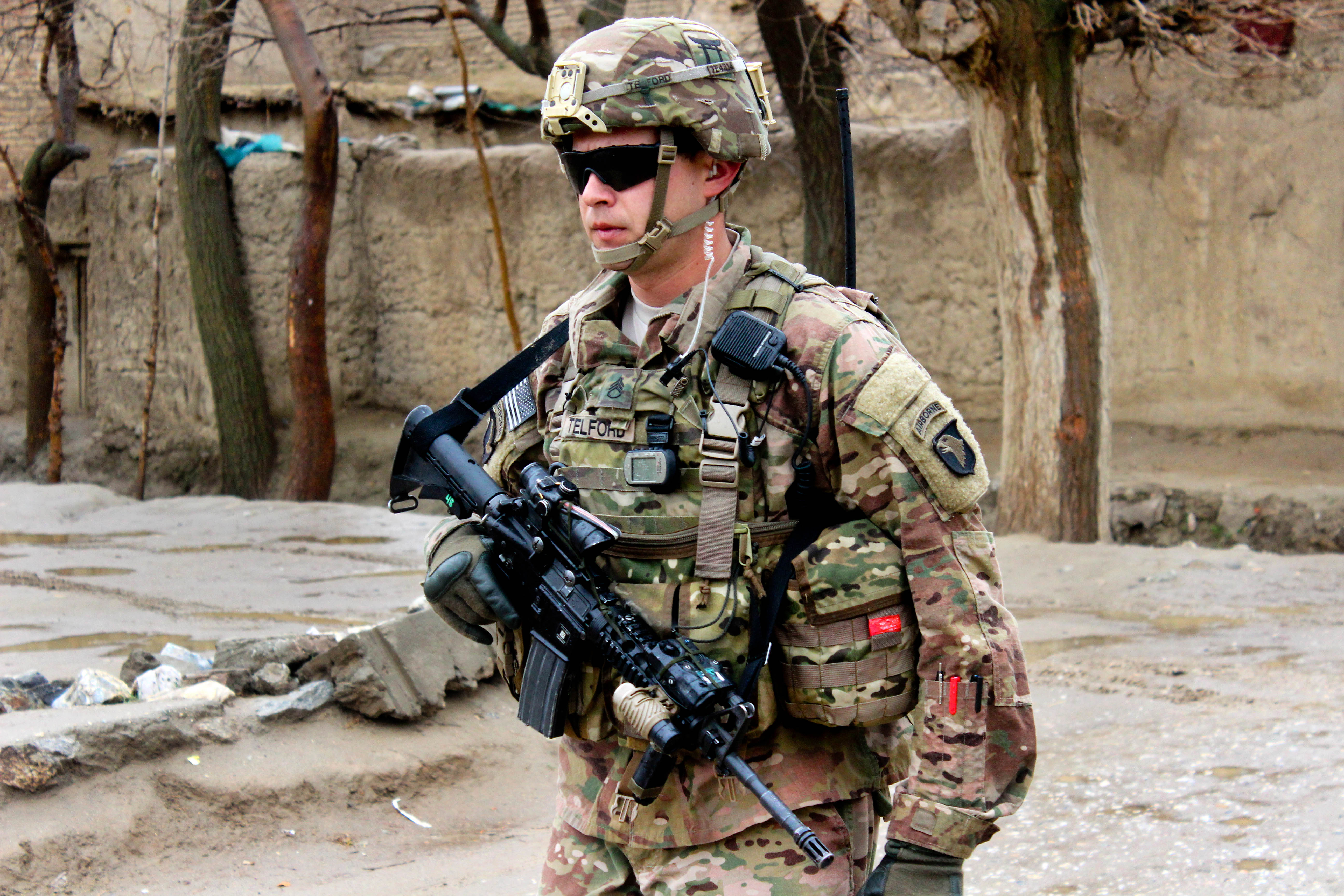 U.S. Army Staff Sgt. Telford provides security while other soldiers conduct  a patrol through a village