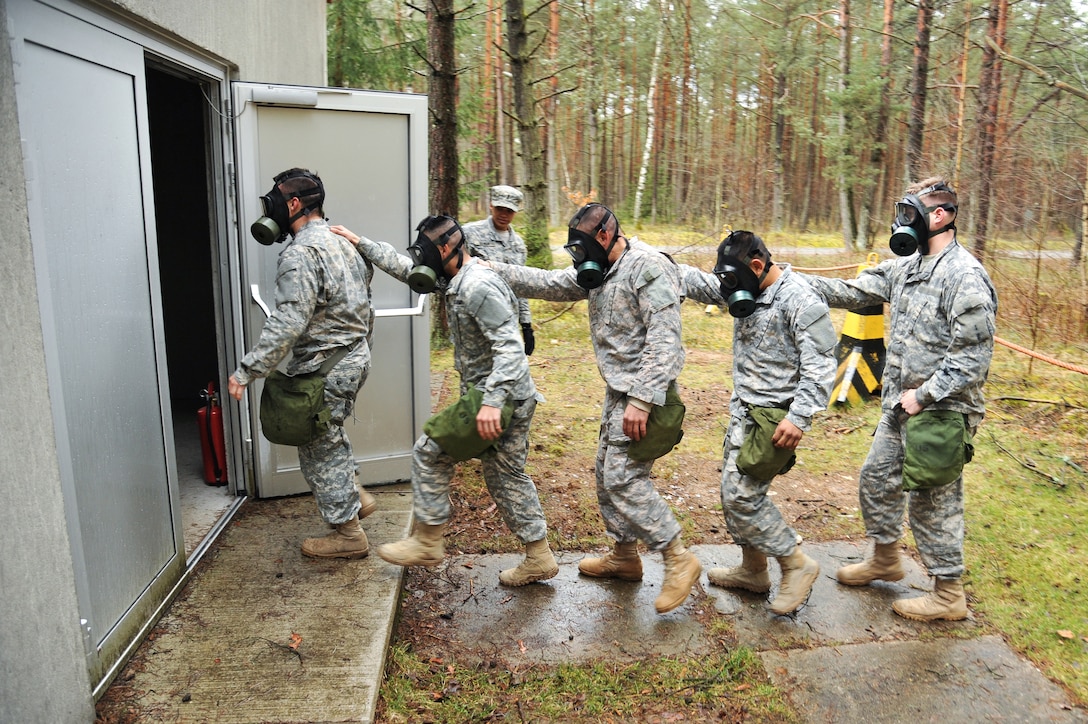 U.S. Army paratroopers enter the gas chamber during chemical, biological, radiological and nuclear training at the 7th Army Joint Multinational Training Command's Grafenwoehr Training Area, Germany, March 31, 2015. 