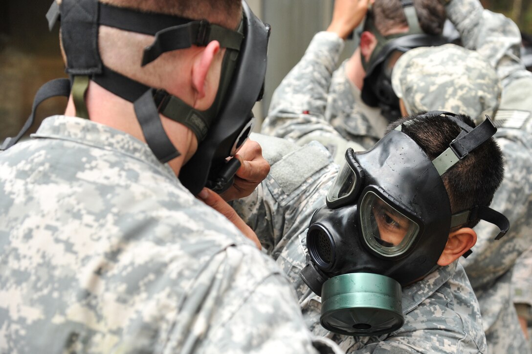 U.S. Army paratroopers check their protective masks before entering the gas chamber to conduct chemical, biological, radiological and nuclear training at the 7th Army Joint Multinational Training Command's Grafenwoehr Training Area, Germany, March 31, 2015. 