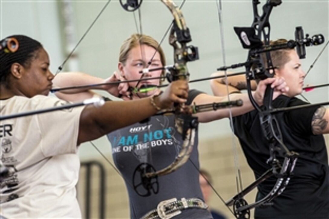 Jasmine Perry, Chasity Kuczer and Laurel Cox compete in the first women’s archery category in Warrior Games history during the Army Trials on Fort Bliss in El Paso, Texas, March 31, 2015. The event will determine who will compete in the Department of Defense Warrior Games 2015 in June.
