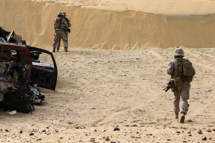 U.S. Marines with 2nd Battalion, 7th Marine Regiment, Special Purpose Marine Air Ground Task Force – Crisis Response – Central Command, rush to locate a simulated downed pilot during a Tactical Recovery of Aircraft and Personnel drill in the Central Command area of operation, March 8, 2015.  TRAP missions are conducted by teams of Marines and sailors to rescue or extract downed personnel or aircraft in the event of an in-flight emergency during combat operations. (U.S. Marine Corps photo by Cpl. Tony Simmons/Released)