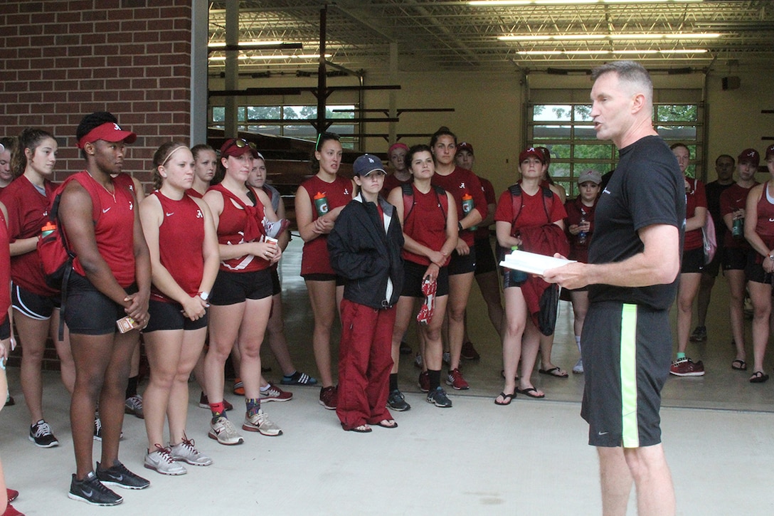 Col. William Bowers, the commanding officer of Sixth Marine Corps District, speaks to the University of Alabama rowing team after the team's training Tuesday, April 28, 2015, in Tuscaloosa, Ala. Bowers was one of several Marines who visited the team that day to recognize Ashley Allison, a Marine officer applicant who is working toward being a pilot.