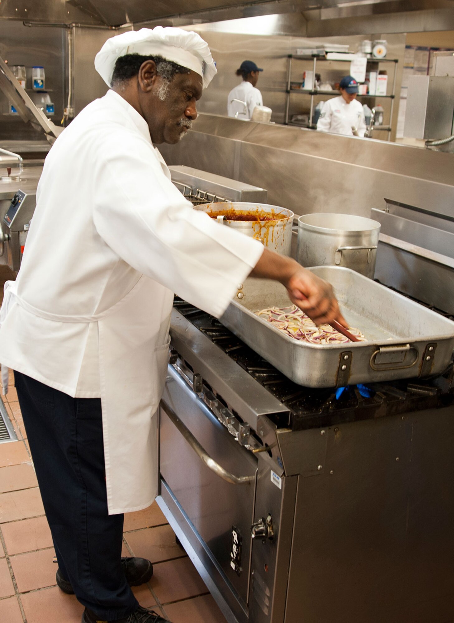 Robert Fowlkes, a 673rd Force Support Squadron food service chef, prepares a dish for dinner at the Iditarod Dining Facility on Joint Base Elmendorf-Richardson, Alaska, March 18, 2015. The 673rd FSS earned the Air Force Curtis E. LeMay award for best large installation-level FSS of the year in the Air Force for 2014. (U.S. Air Force photo/Airman 1st Class Tammie Ramsouer)