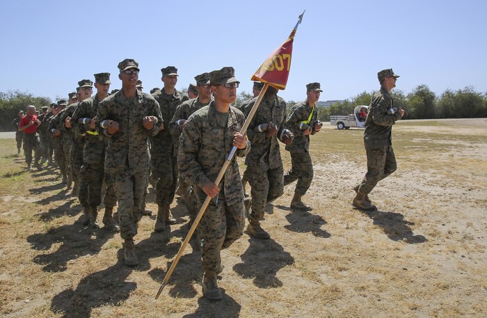 Private First Class Mark-Louie H. Taocta, Platoon 1007, Alpha Company, 1st Recruit Training Battalion, leads his platoon to the football field where they will take on the Combat Fitness Test at Marine Corps Recruit Depot San Diego, April 9. Taocta moved to the United States at the age of 15 not knowing any English or having an understanding of the American culture.  He quickly overcame this challenge and decided to join the Marine Corps after being inspired by his father who served in the Philippine Marine Corps.