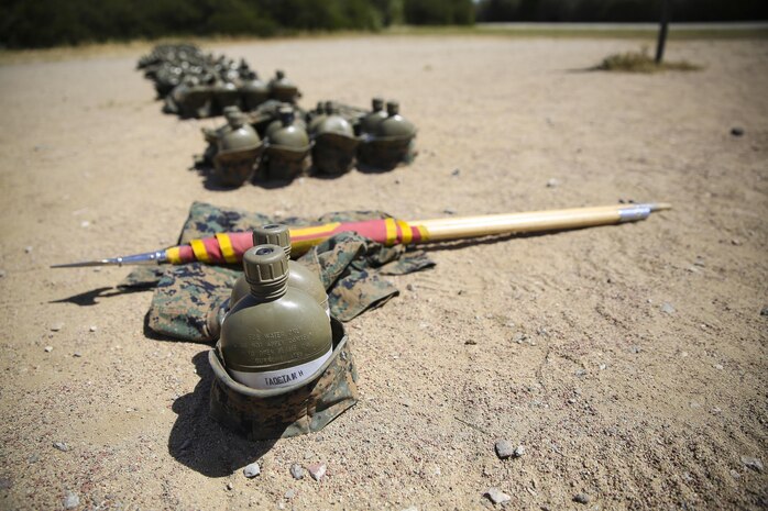The gear of Pfc. Mark-Louie H. Taocta, Platoon 1007, Alpha Company, 1st Recruit Training Battalion, lays at the front of the platoon while the recruits conduct the Combat Fitness Test at Marine Corps Recruit Depot San Diego, April 9.  Taocta had a chance to learn the knowledge and skills required to lead a platoon while speaking to others while he was waiting in MRP.  This experience led Taocta to instantly earn the position of guide.