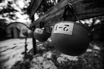 Failed Tactical Air Control Party candidates helmets hang during a field training exercise at Eglin Range, Fla., March 24, 2015. TAC-P candidates from Falcon 98 are the last class to graduate from Hurlburt Field, Fla., before the schoolhouse moves to Lackland Air Force Base, Texas. (U.S.  Air Force photo/Senior Airman Christopher Callaway)