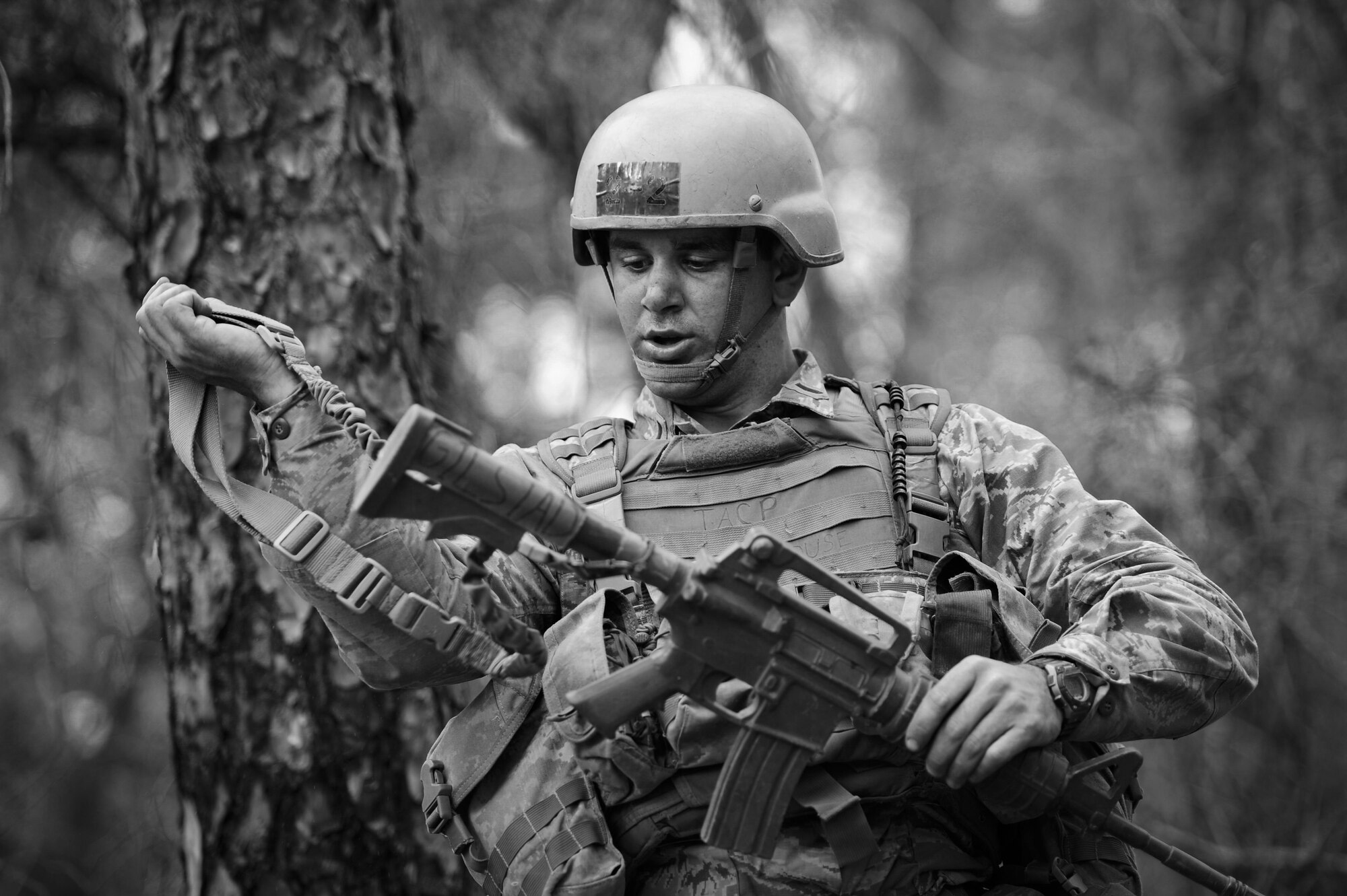 Matthew Gilstad, a Tactical Air Control Party candidate from Falcon 98, looks down the sight of his weapon during a field training exercise at Eglin Range, Fla., March 23, 2015. TAC-P candidates from Falcon 98 are the last class to graduate from Hurlburt Field, Fla., before the schoolhouse moves to Lackland Air Force Base, Texas. (U.S.  Air Force photo/Senior Airman Christopher Callaway)