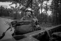 Matthew Gilstad, a Tactical Air Control Party candidate from Falcon 98, loads his rucksack onto a HUMVEE during a field training exercise at Eglin Range, Fla., March 23, 2015. TAC-P candidates from Falcon 98 are the last class to graduate from Hurlburt Field, Fla., before the schoolhouse moves to Lackland Air Force Base, Texas. (U.S.  Air Force photo/Senior Airman Christopher Callaway)