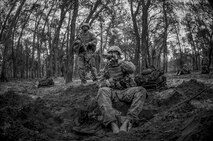 Tactical Air Control Party candidates from Falcon 98 eat MREs during a field training exercise at Eglin Range, Fla., March 24, 2015. TAC-P candidates from Falcon 98 are the last class to graduate from Hurlburt Field, Fla., before the schoolhouse moves to Lackland Air Force Base, Texas. (U.S.  Air Force photo/Senior Airman Christopher Callaway)