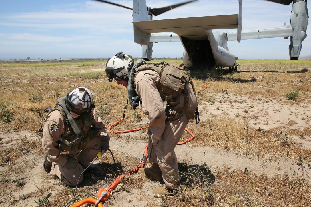 Marines with Marine Medium Tiltrotor Squadron 163, 3rd Marine Aircraft Wing, participated in Camp Pendleton’s annual Wildland Firefighting Exercise at Las Pulgas Lake, April 30. The Marines manned the MV-22 Osprey flying from Marine Corps Air Station Miramar to assist in the joint exercise which provides ready, trained and certified military and civilian resources to combat wild land fires in the region. Aviation and ground units from Camp Pendleton, 3rd MAW, Navy Region Southwest, the California Department of Forestry and Fire Protection, and the San Diego Sheriff’s Department participated in the exercise.