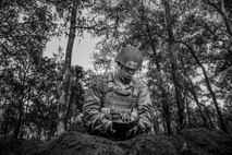 A Tactical Air Control Party candidate from Falcon 98 digs a sleeping hole during a field training exercise at Eglin Range, Fla., March 24, 2015. TAC-P candidates from Falcon 98 are the last class to graduate from Hurlburt Field, Fla., before the schoolhouse moves to Lackland Air Force Base, Texas. (U.S.  Air Force photo/Senior Airman Christopher Callaway)