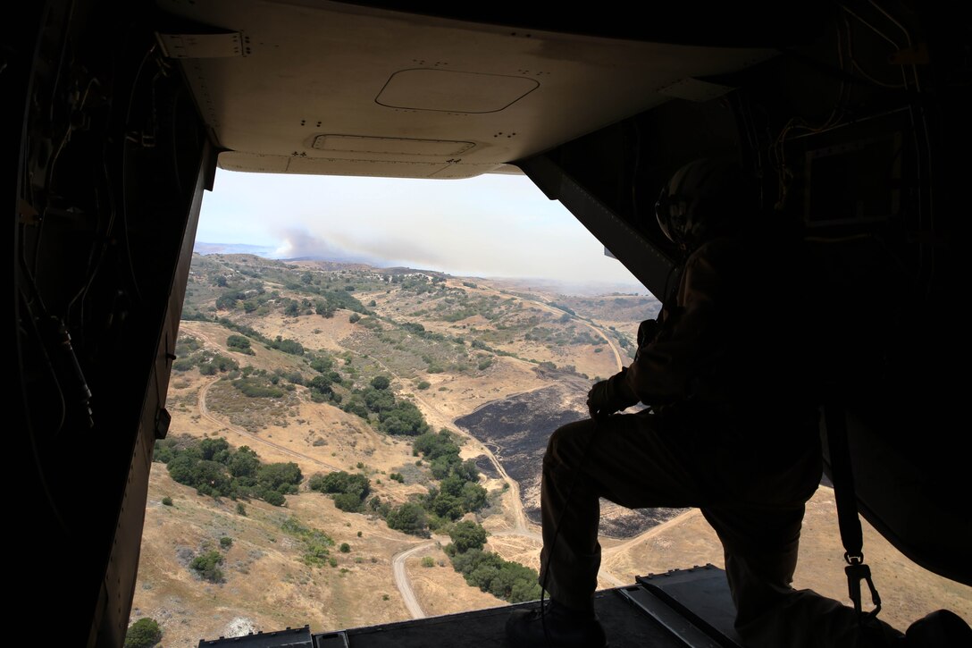 Marines with Marine Medium Tiltrotor Squadron 163, 3rd Marine Aircraft Wing, participated in Camp Pendleton’s annual Wildland Firefighting Exercise at Las Pulgas Lake, April 30. The Marines manned the MV-22 Osprey flying from Marine Corps Air Station Miramar to assist in the joint exercise which provides ready, trained and certified military and civilian resources to combat wild land fires in the region. Aviation and ground units from Camp Pendleton, 3rd MAW, Navy Region Southwest, the California Department of Forestry and Fire Protection, and the San Diego Sheriff’s Department participated in the exercise.