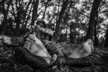 A Tactical Air Control Party candidate from Falcon 98 eats an MRE during a field training exercise at Eglin Range, Fla., March 24, 2015. TAC-P candidates from Falcon 98 are the last class to graduate from Hurlburt Field, Fla., before the schoolhouse moves to Lackland Air Force Base, Texas. (U.S.  Air Force photo/Senior Airman Christopher Callaway)