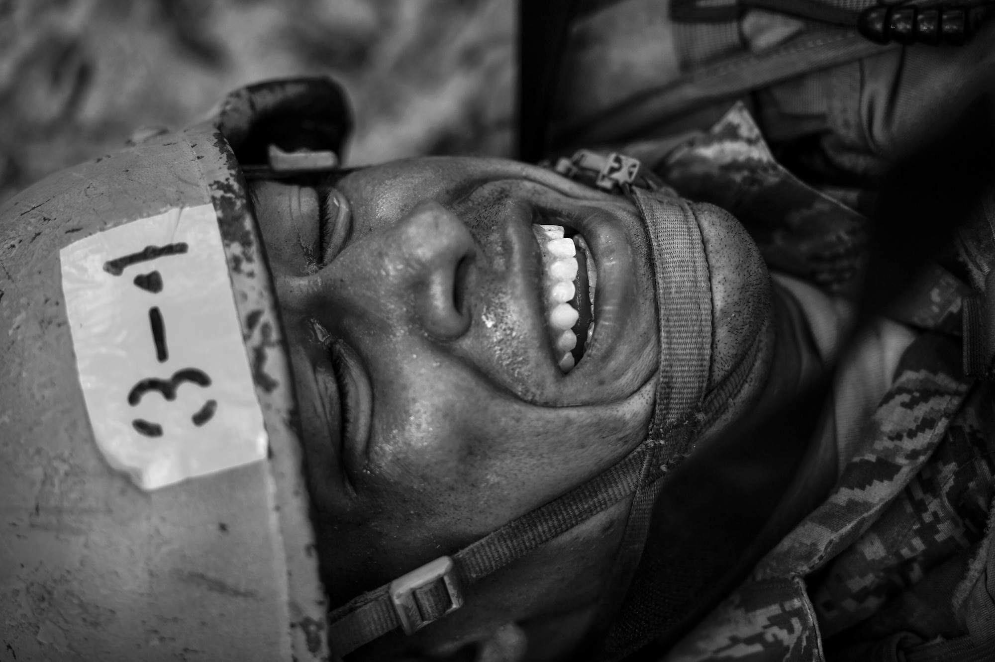 A Tactical Air Control Party candidate from Falcon 98, fights through pain during physical training at Eglin Range, Fla., March 24, 2015. TAC-P candidates from Falcon 98 are the last class to graduate from Hurlburt Field, Fla., before the schoolhouse moves to Lackland Air Force Base, Texas. (U.S.  Air Force photo/Senior Airman Christopher Callaway)