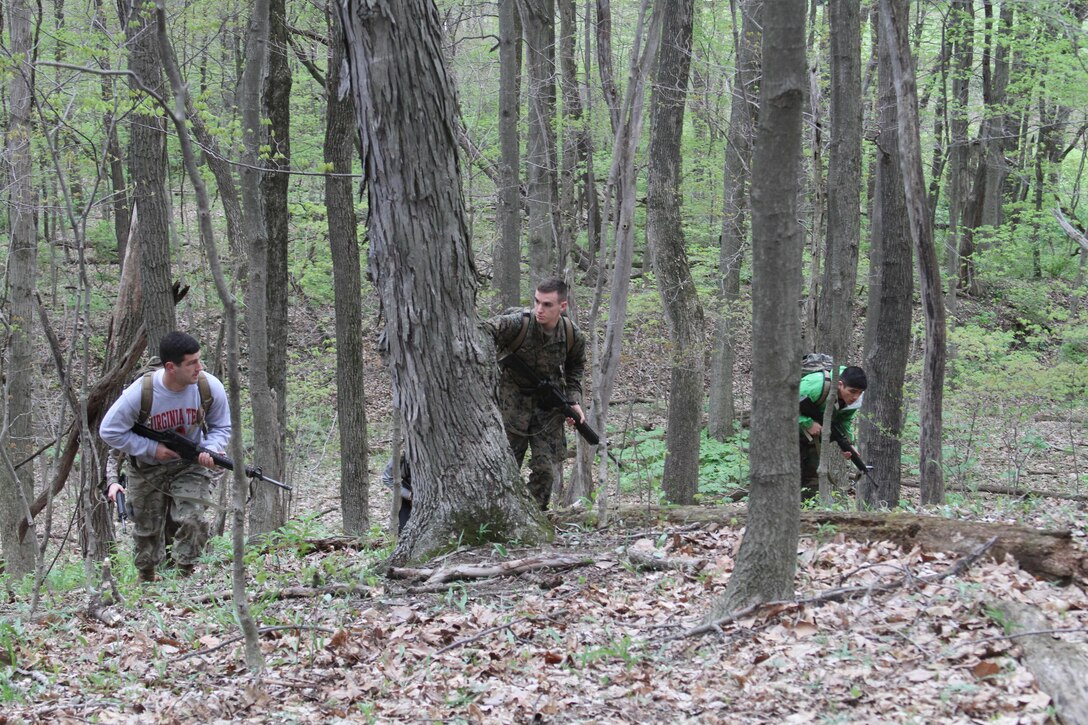 Marine Corps officer candidates from Recruiting Stations Louisville and Charleston work on land navigation and combat tactics at Camp Sherman Joint Training Center in Chillicothe, Ohio, April 25, 2015. Candidates endured many physical and mental challenges during their mini OCS such as limited sleep and long days with physical fitness tests, combat maneuvers and leadership development. (U.S. Marine Corps photo by Cpl. Kyle Welshans/Released)