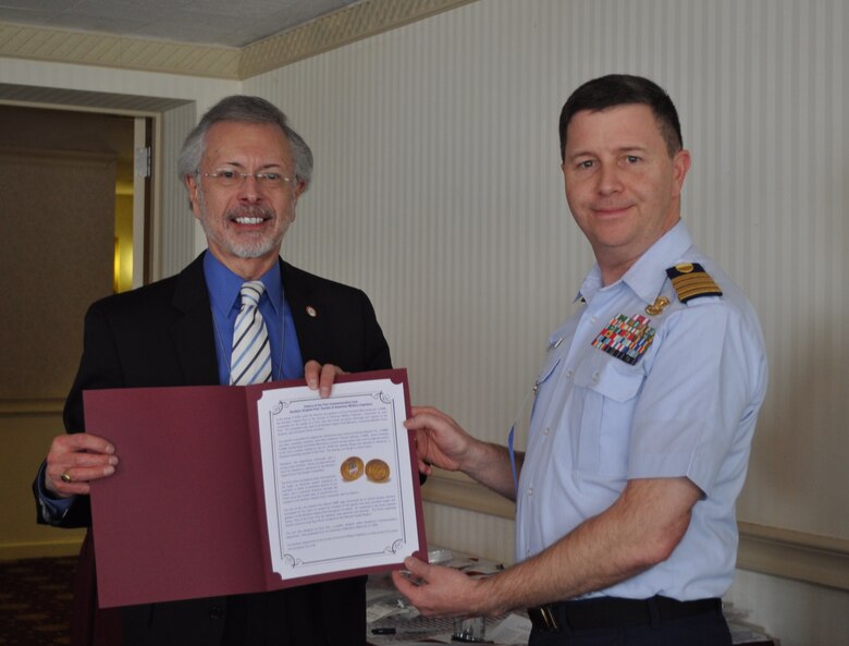 Captain Bob Bevins, US Coast Guard and President of the Northern Virginia SAME Post, presented Bob Pietrowsky with a NoVA SAME Post coin as a memento of his speech and visit to the Post.