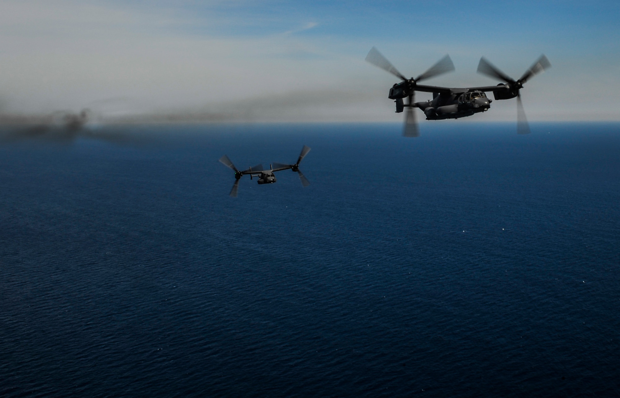 Two CV-22 Ospreys fly in formation over Fort Walton Beach, Fla., April 24, 2015. The two ospreys performed a flyover for the annual Operation Eagle Claw ceremony held at the Airpark on Hurlburt Field, Fla. (U.S. Air Force photo/Senior Airman Christopher Callaway)