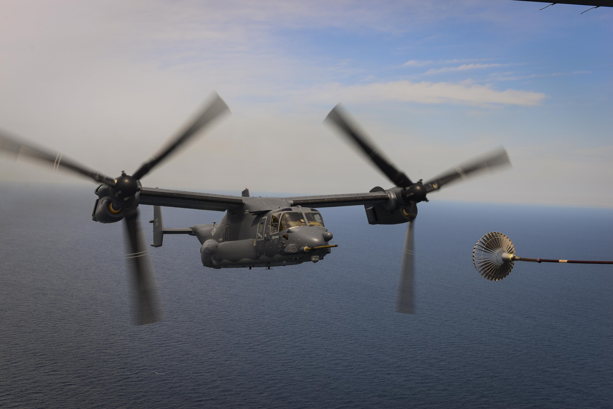 A CV-22 Osprey approaches an MC-130H Combat Talon II air-refueling receptacle during a training mission at Hurlburt Field, Fla., April 24, 2015. The Osprey is a tiltrotor aircraft that combines the vertical takeoff, hover and vertical landing qualities of a helicopter with the long-range, fuel efficiency and speed characteristics of a turboprop aircraft. (U.S. Air Force photo/Senior Airman Christopher Callaway)