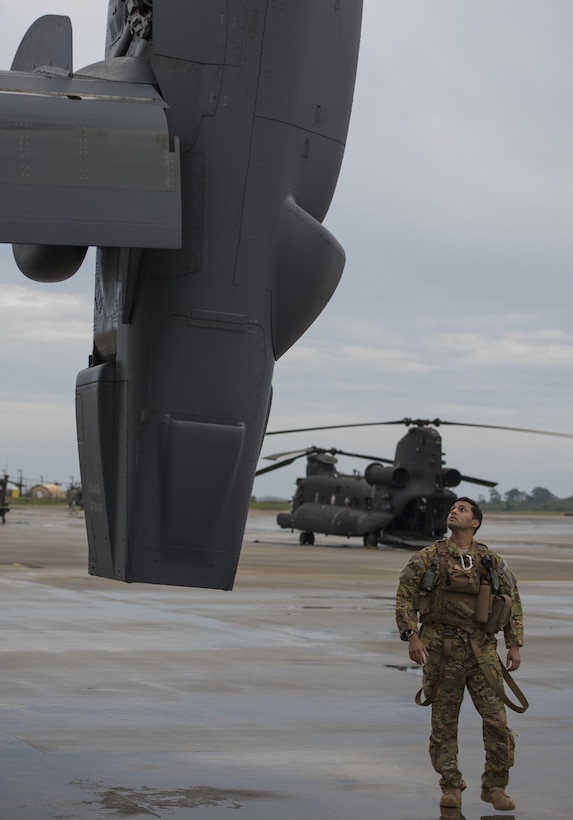 An 8th Special Operations Squadron pilot completes pre-flight checks on a CV-22 Osprey during Emerald Warrior 2015 at Hurlburt Field, Fla., April 27, 2015. The primary mission of the 8th SOS is insertion, extraction and resupply of unconventional warfare forces and equipment into hostile or enemy-controlled territory using airland or airdrop procedures. Emerald Warrior is the Defense Department’s only irregular warfare exercise, allowing joint and combined partners to train together and prepare for real-world contingency operations. (U.S. Air Force photo/Staff Sgt. DeAndre Curtiss)