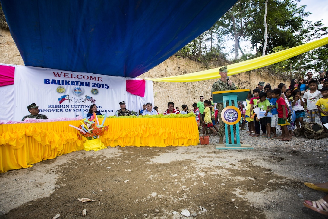 U.S. Navy Capt. James Meyer, commodore of the 30th Naval Construction Regiment, speaks to the members of the community about the work put into the Sabang Elementary School as part of the ribbon cutting ceremony in Puerto Princesa, Philippines, during exercise Balikatan 2015, April 28. The ribbon cutting ceremony was chance for members of the community and military come together and celebrate the recently finished classroom. Balikatan provides an opportunity for Philippine and U.S. forces to continue strengthening relationships and work together.