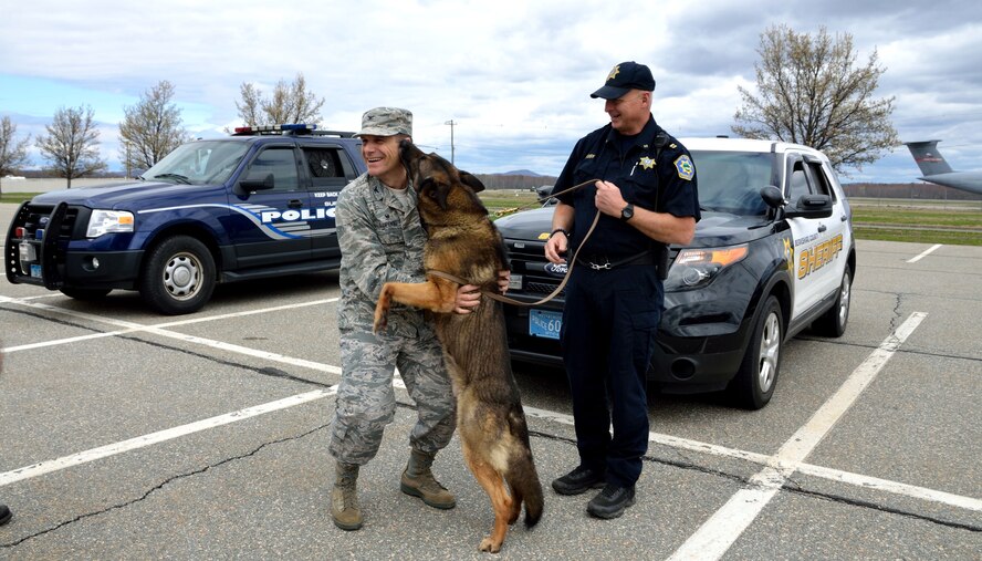 Wing Commander Col. Al Lupenski receives thanks from a Berkshire County Police K9. Many K9 units from the area participated in the Massachusetts Police Working Dog Association's 2015 K9 Patrol/Narcotic/Explosives Detection Workshop, which took place on Westover Air Reserve Base in April.