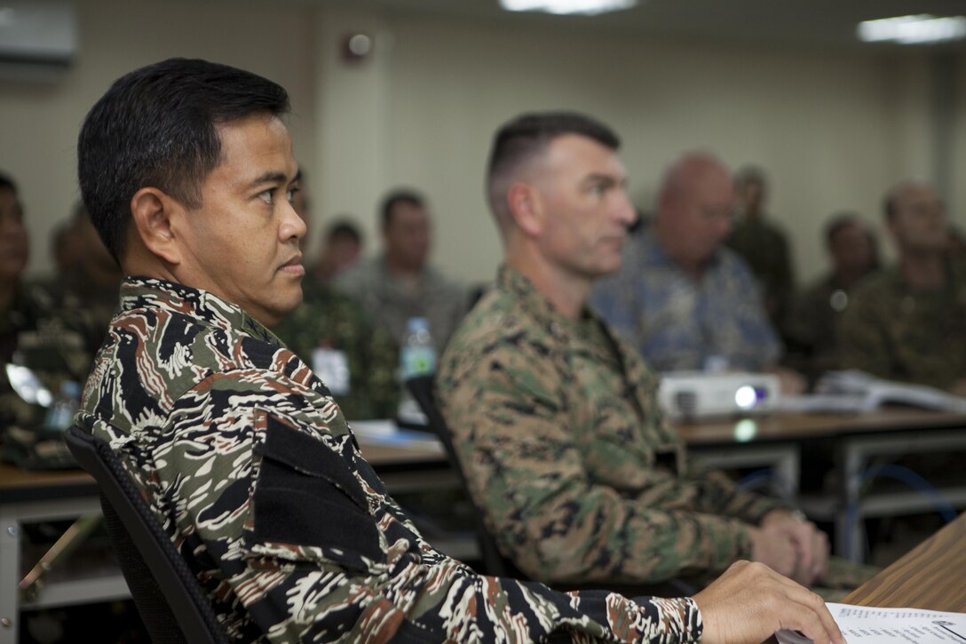 Armed Forces of the Philippines Vice Adm. Alexander S. Lopez, Jr., Balikatan 2015 AFP exercise director, listens during a commander's update brief in the joint operations center, Camp Aguinaldo, Quezon City, Philippines during Balikatan, April 28. The exercise provides an opportunity for Philippine, Australian and U.S. forces to continue strengthening relationships and work together to enhance combined capabilities.