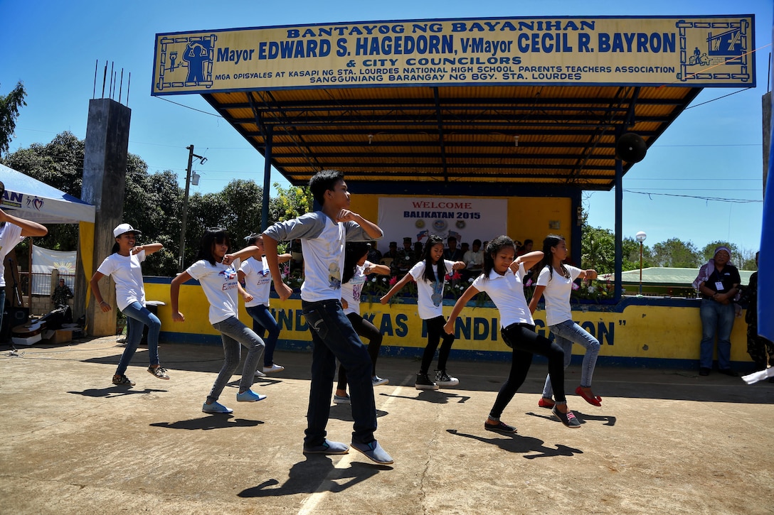 Teenagers dance during a ribbon cutting and turnover of school buildings ceremony at Santa Lordes High School in Puerto Princesa, on the island of Palawan, Philippines, April 29. The construction was part of humanitarian and civic action projects during exercise Balikatan 2015. This year marks the 31st iteration of the exercise, which is an annual Philippines-U.S. military bilateral training exercise and humanitarian civic assistance engagement.