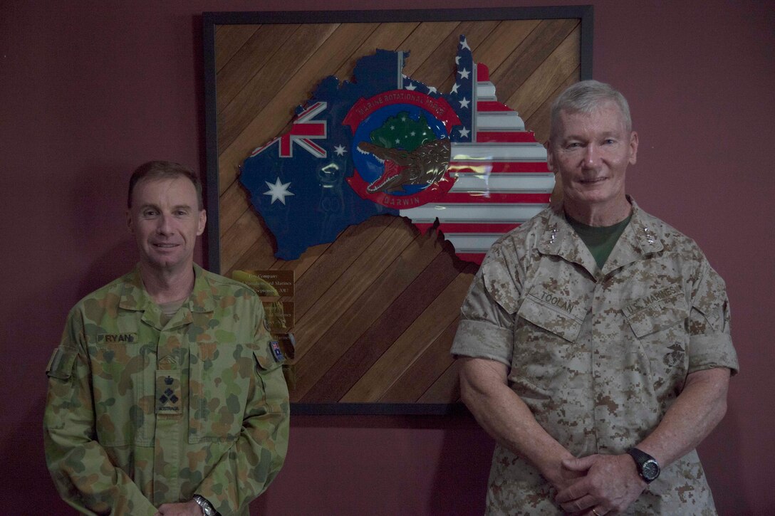Lieutenant General Toolan, right, poses for a photo with BRIG Mick Ryan, left, April 24 at the Officers Mess at Robertson Barracks, Palmerston, Australia. Toolan is visiting the Marines of Marine Rotational Force – Darwin during his trip around the Pacific. The rotational deployment in Darwin enables Marines to more effectively train, exercise, and operate with partners, by enhancing regional security and building capacity to respond more rapidly to natural disasters and crises throughout that region. Toolan is the commander of U.S. Marine Corps Forces, Pacific. Ryan is the commander of 1st Brigade, Australian Army, Australian Defence Force.