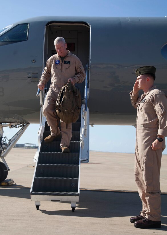 Lieutenant General John A. Toolan walks down from an aircraft April 24 after arriving at Royal Australian Air Force Base Darwin, Darwin, Australia. Toolan is visiting the Marines of Marine Rotational Force – Darwin during his trip around the Pacific. The rotational deployment in Darwin enables Marines to more effectively train, exercise, and operate with partners, by enhancing regional security and building capacity to respond more rapidly to natural disasters and crises throughout that region. Toolan is the commander of U.S. Marine Forces, Pacific.