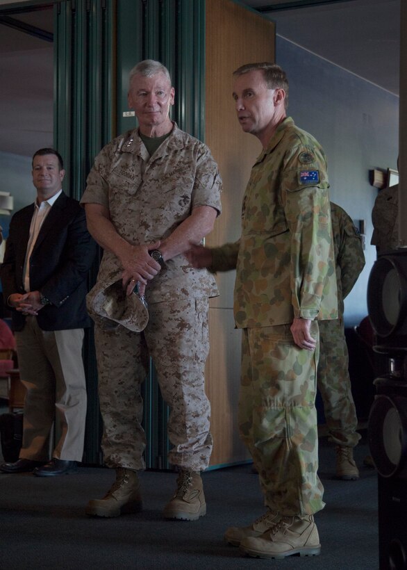 Brigadier Mick Ryan, right, introduces Lt. Gen. John A. Toolan, left, at the Officers Mess at Robertson Barracks, Palmerston, Australia. Toolan is visiting the Marines of Marine Rotational Force – Darwin during his trip around the Pacific. The rotational deployment in Darwin enables Marines to more effectively train, exercise, and operate with partners, by enhancing regional security and building capacity to respond more rapidly to natural disasters and crises throughout that region. Toolan is the commander of U.S. Marine Corps Forces, Pacific. Ryan is the commander of 1st Brigade, Australian Army, Australian Defence Force.
