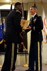 Army Capt. Kent Wyman, right, commander of Headquarters Company, 54th Troop Command, New Hampshire Army National Guard, receives the 2015 Chief Medical Services Junior Officer Award of Excellence during a ceremony April 30, 2015, in Washington, D.C. Wyman was among more than 100 applicants from both the Army Guard and Army Reserve, and was selected by the Medical Services Corps as the officer who has made the most significant contributions to the U.S. Army Medical Department mission while performing in an exceptionally outstanding manner.
