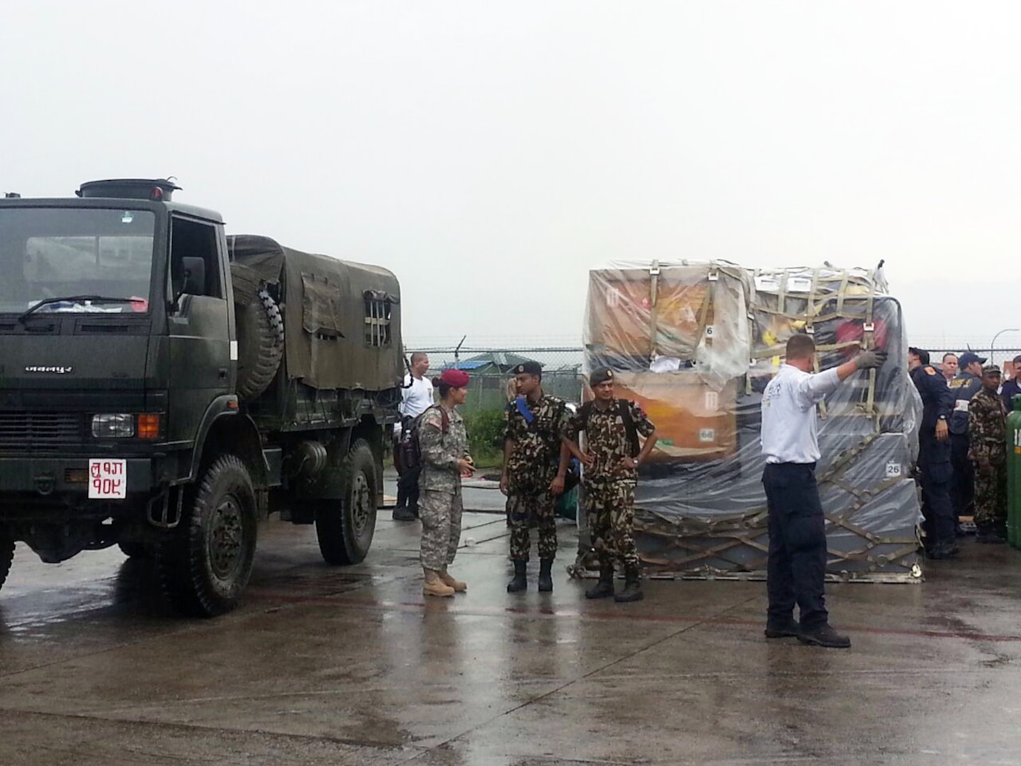 TRIBHUVAN, Nepal (Apr. 29, 2015) - The U.S. Civil Military Support Element (CMSE) Nepal coordinates with Nepalese Army soldiers at Tribhuvan International Airport to use Nepalese Army trucks to move search and rescue equipment that arrived in Nepal. A CMSE is a U.S. military civil affairs team which assists the U.S. Ambassador with civil-military programs and projects that support U.S. and host-nation objectives. 