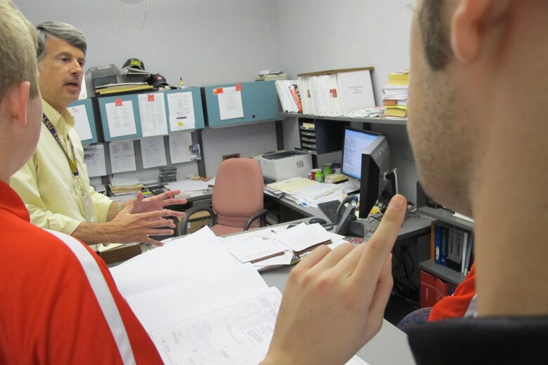 Roderick Bridgeman, chief, Mechanical Engineering Branch explains blueprints during mentoring session April 23.