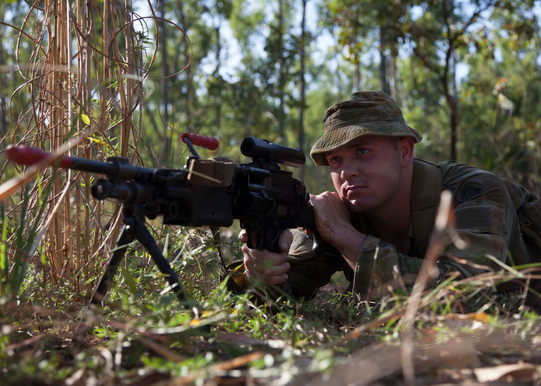 Private Ian Hill provides security for his squad April 29 during the Subject One Corporal Army Course at Robertson Barracks, Palmerston, Northern Territory, Australia. Subject One Corporal Army Course is run by the Warrant Officer and Non Commissioned Officer Academy and is an excellent opportunity to improve our knowledge of one another’s militaries which ultimately strengthen our interoperability. Warrant Officer and Non Commissioned Officer Academy is a subordinate training establishment of the Land Warfare Centre, Royal Military College of Australian. Hill is a driver specialist with Combat Engineer Regiment, 1st Brigade, Australian Army, Australian Defence Force.