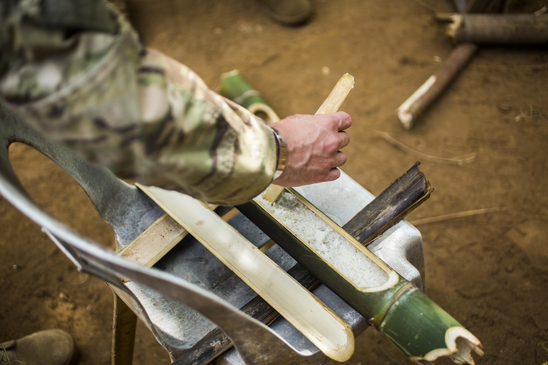 Service members from the Philippine Marine Corps, Coast Guard, National Police and U.S. participate in Jungle Survival training in Puerto Princesa, Philippines, during exercise Balikatan 2015, April 28. The Jungle Survival training, taught by the Philippine Marine Corps, was held to instruct military members and practice techniques to become more effective when responding to crisis in the region.
