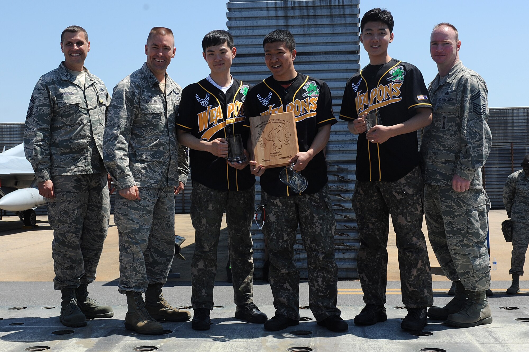 Republic of Korea’s Air Force 38th Maintenance Squadron, crew 111, wins the 2015 peninsula-wide load competition at Kunsan Air Base, ROK, April 25, 2015. The competition  had six teams representing the 35th and 80th Aircraft Maintenance Units, the 120th Expeditionary AMU, ROKAF’s 38 Maintenance Squadron, and the 36th and 25th AMUs from Osan AB. (U.S. Air Force photo by Senior Airman Divine Cox/Released)