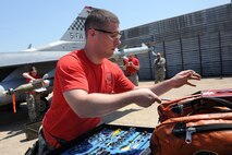 U.S. Air Force member with the 36th Aircraft Maintenance Unit inspects his tools during the 2015 peninsula-wide load competition at Kunsan Air Base, Republic of Korea, April 25, 2015. The competition  had six teams representing the 35th and 80th Aircraft Maintenance Units, the 120th Expeditionary AMU, ROKAF’s 38 Maintenance Squadron, and the 36th and 25th AMUs from Osan AB. (U.S. Air Force photo by Senior Airman Divine Cox/Released)