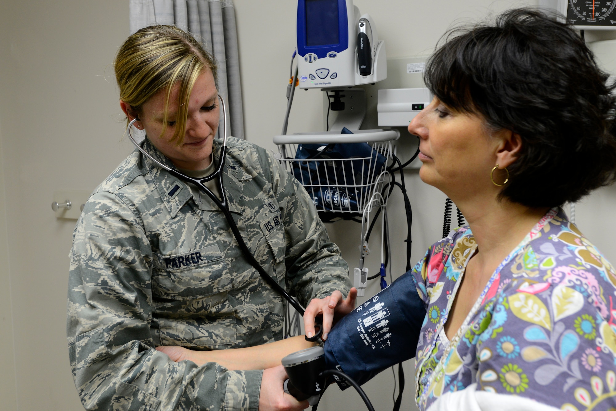 1st Lt. Holly Parker, 22nd Medical Operations Squadron Physician Assistant, checks a patient’s blood pressure, April 22, 2015, at McConnell Air Force Base, Kan. Parker is one of three PAs at Team McConnell and is part of a team who serves more than 11,000 beneficiaries across Team McConnell. (U.S. Air Force photo by Senior Airman Trevor Rhynes)