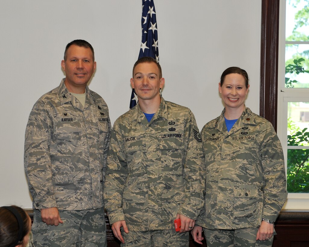 Col. Kurt Kayser, 14th Mission Support Group Commander, and Maj. Miranda Lashinski, 14th Contracting Squadron Commander, congratulate Tech. Sgt. Bryan Galcik, 14th CONS, May 1 in the Contracting office on Columbus Air Force Base, Mississippi. Galcik was accepted into Officer Training School, a nine-week U.S. Air Force commissioning program located at Maxwell Air Force Base, Alabama .  When deciding who should attend OTS, the selection board reviews numerous factors such as an grade point average and Air Force Officer Qualifying Test scores, as well as work experience, accomplishments, adaptability, character, leadership ability and potential for future growth. 