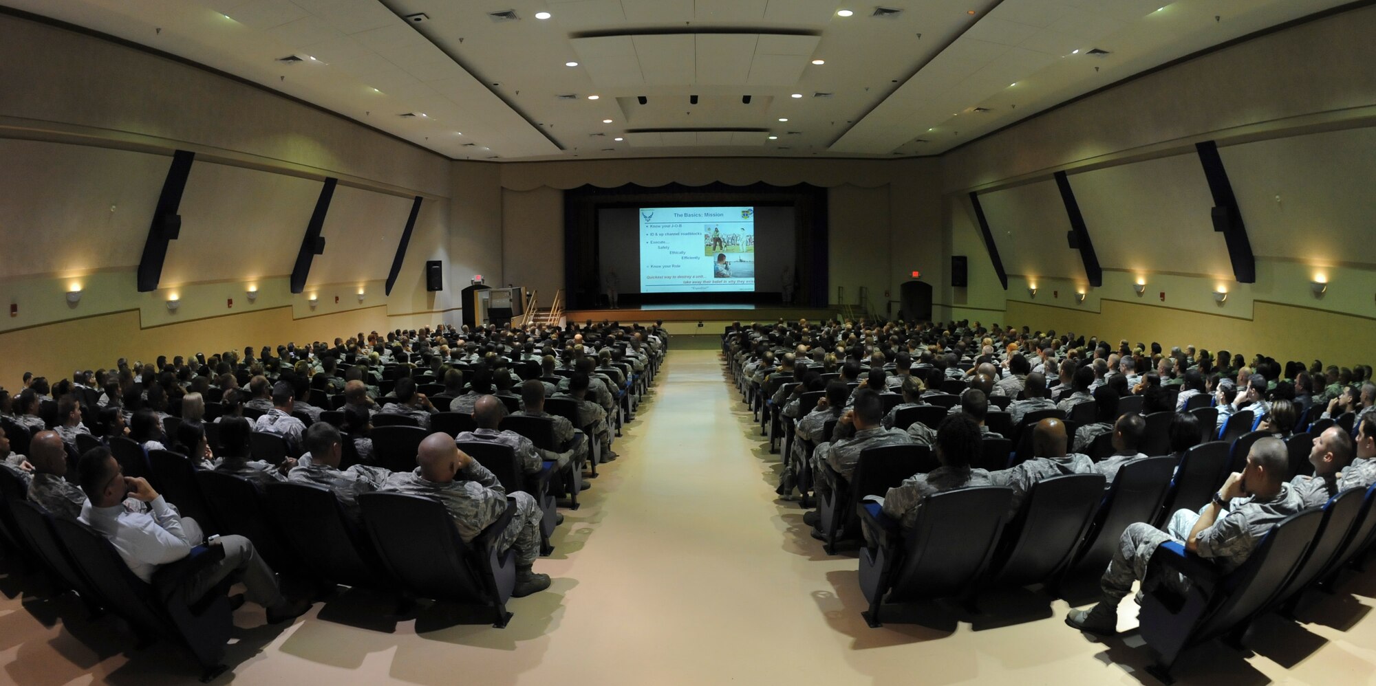 Lt. Gen. Carlton D. Everhart II, 18th Air Force commander and Chief Master Sgt. Robert Rodewald, 18th Air Force Command Chief, speak to Airmen during an all-call April 29, 2015, at MacDill Air Force Base, Fla. The main topics of the presentation were centered on mission, Airmen, and family. (U.S. Air Force photo by Airman 1st Class Danielle Conde/Released)