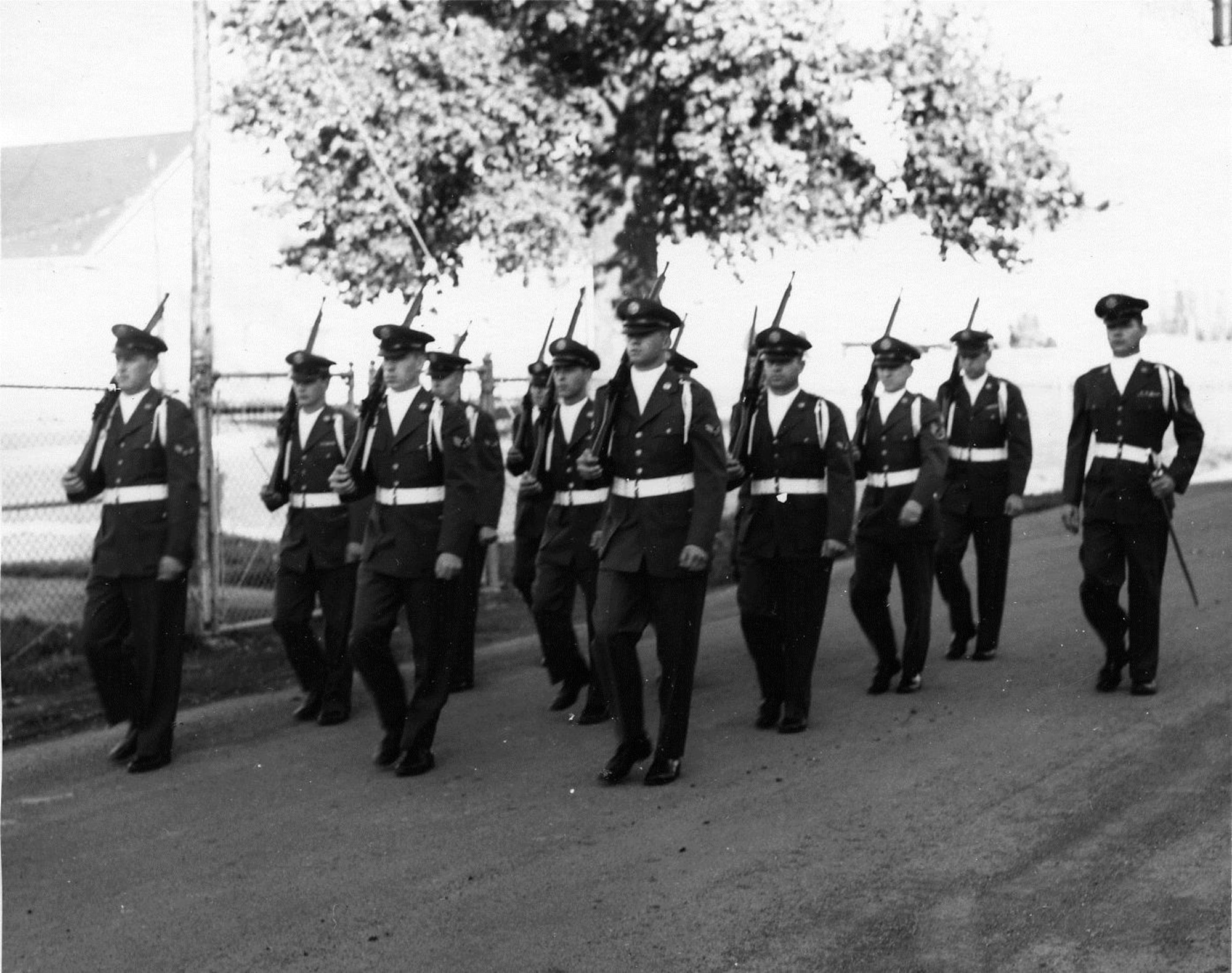 OreANG Precision Rifle Drill Team members march in the November, 1961, Veterans Day Parade.  The parade route went through a two-mile stretch of Southeast Portland.  (142FW History Archives)