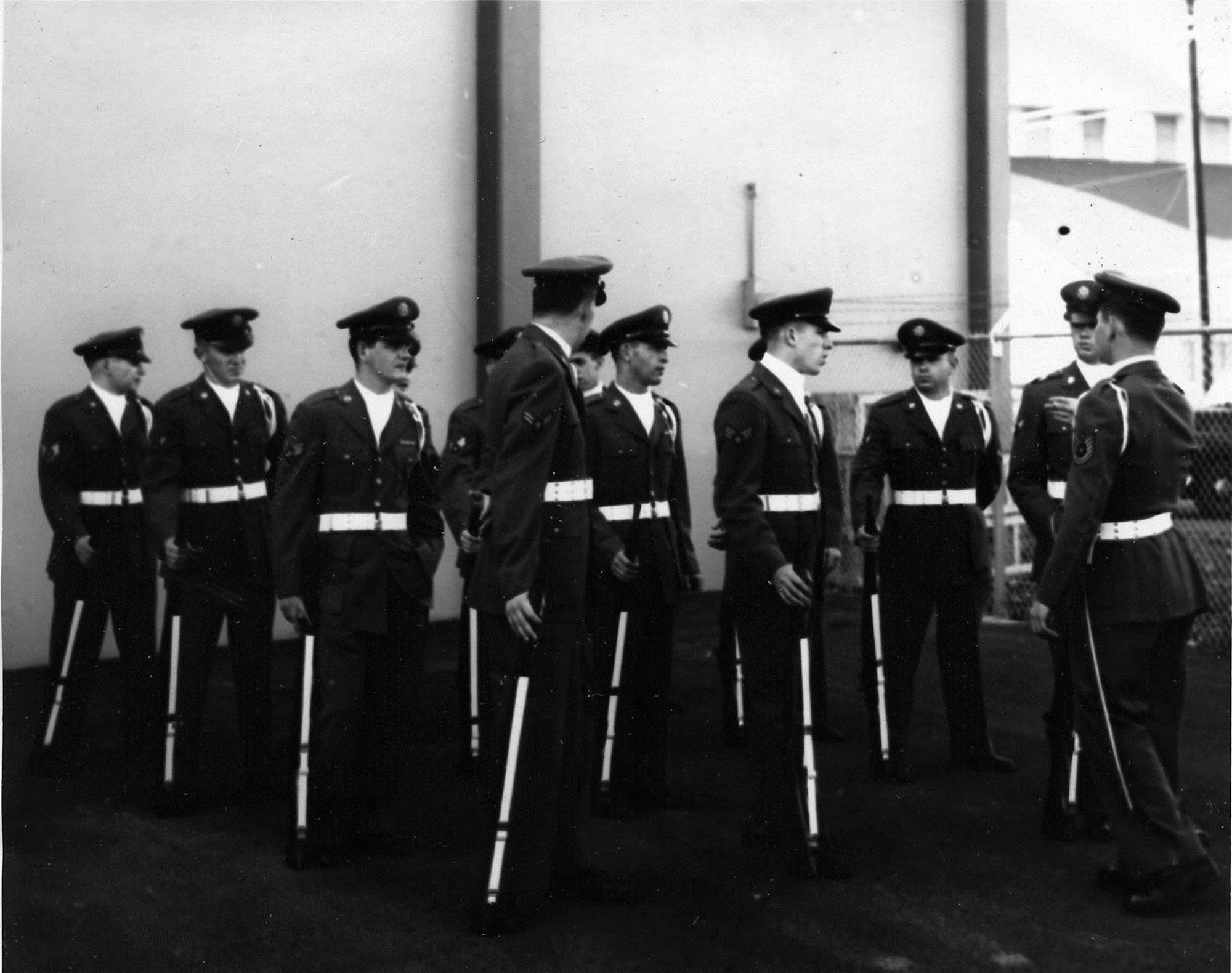 Team Leader Tech. Sgt. Robert Cain briefs his Airmen prior to a performance of the OreANG Precision Rifle Drill Team in the early 1960’s.   Note the seasonal uniform change with members wearing AF service dress blue uniforms.  (142FW History Archives)