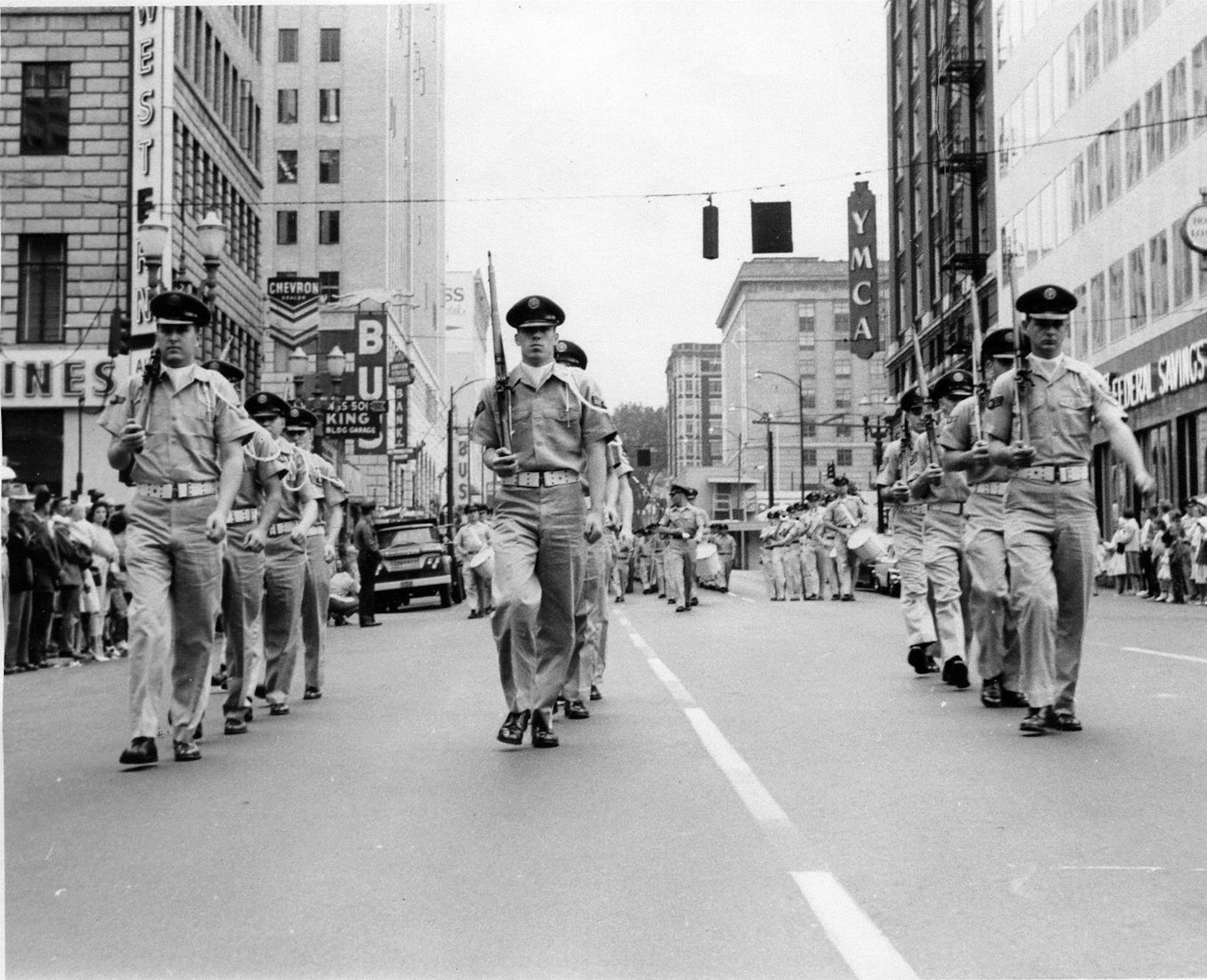 OreANG Precision Rifle Drill Team members march in khaki uniforms during the 11th Annual Armed Forces Day Parade in downtown Portland, May 20, 1961.  This picture was taken just before their precision maneuver in front of the official reviewing stand.  (142FW History Archives)