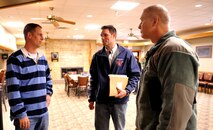 From left, Col. Philip A. Clinton, Air Mobility Command Inspector General division chief, speaks with Robert Zafke, 319th Air Base Wing Inspector General inspector, and Col. Paul Bauman, 319th Air Base Wing commander, April 19, 2015, on Grand Forks Air Force Base, N.D. Clinton led a capstone team of more than 50 inspectors to complete a Unit Effectiveness Inspection of the 319th ABW during the fourth week of April. (U.S. Air Force photo by Staff Sgt. Susan L. Davis/Released)