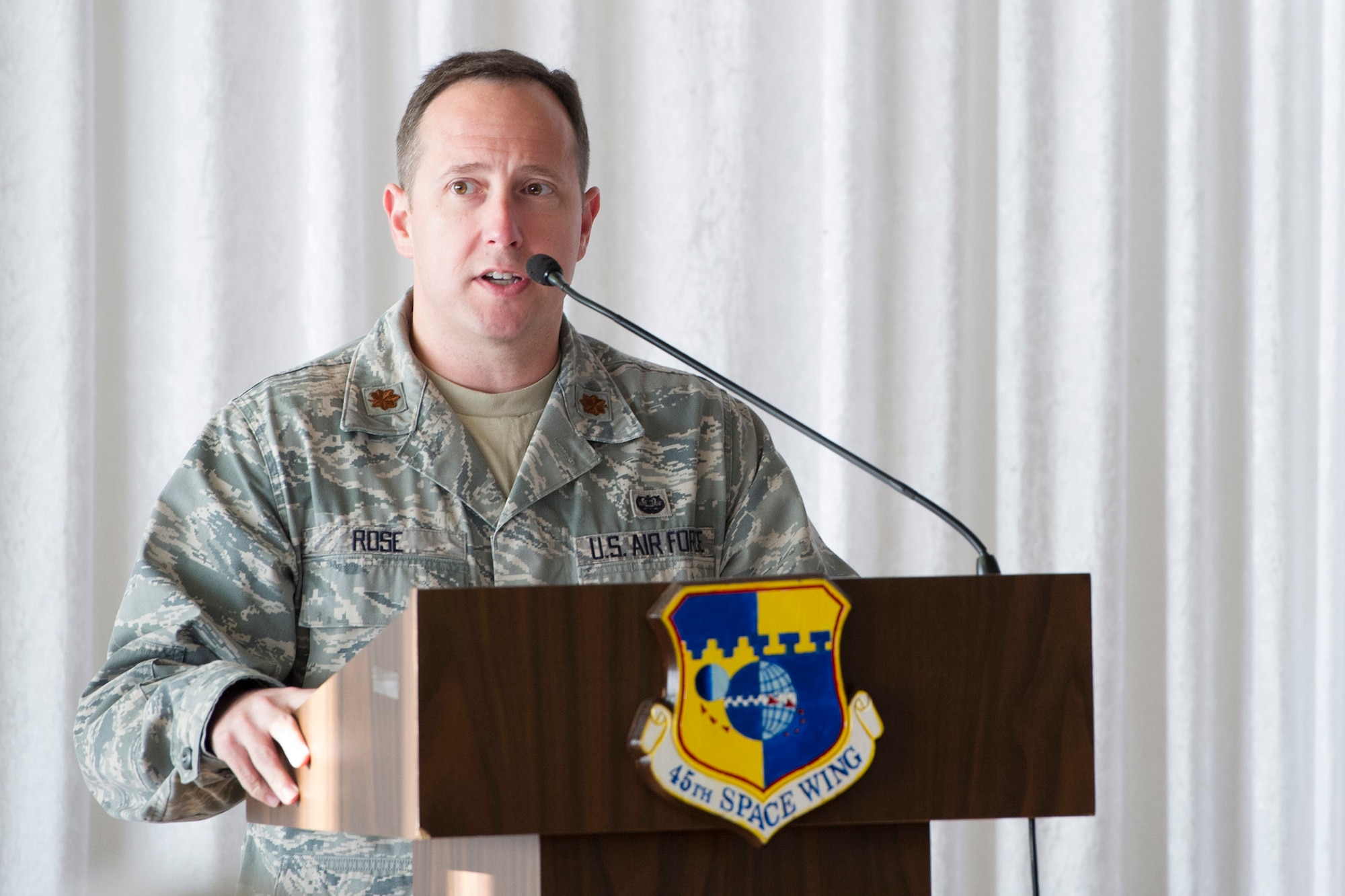 Maj. Alex Rose, 45th Space Wing assistant staff judge advocate, reads the Jewish Shema Prayer with an interpretation, during the National Prayer Breakfast, May 1, at the Tides Club at Patrick Air Force Base, Fla. Each representative shared their religious reading with Team Patrick-Cape on the topic related to the difference between hearing and listening. (U.S. Air Force photo/Matthew Jurgens) 