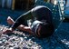 A “victim” lies wounded, awaiting care during an active shooter exercise April 30, 2015 at Holloman Air Force Base, N.M. During the exercise, SFS members cleared buildings, and went head-to-head with the active shooter, before providing self-aid-buddy care to the casualties. (U.S. Air Force photo by Airman 1st Class Emily A. Kenney/Released)  