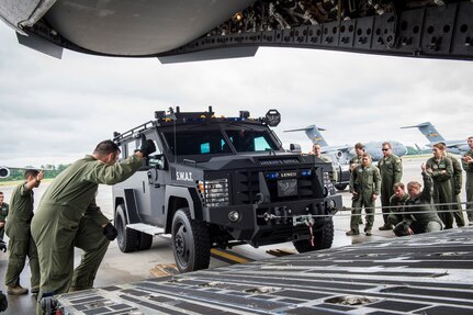 Loadmasters from the 14th Airlift Squadron winch a Charleston County Sheriff’s Office Special Weapons and Tactics vehicle into a C-17 Globemaster III April 29, 2015, on the flightline at Joint Base Charleston, S.C. Many new loadmasters do not get the opportunity to load large cargo items like Mine-Resistant Ambush Protected vehicles in a condensed timeframe until they deploy which can be very intimidating. (U.S. Air Force photo/Airman 1st Class Clayton Cupit)