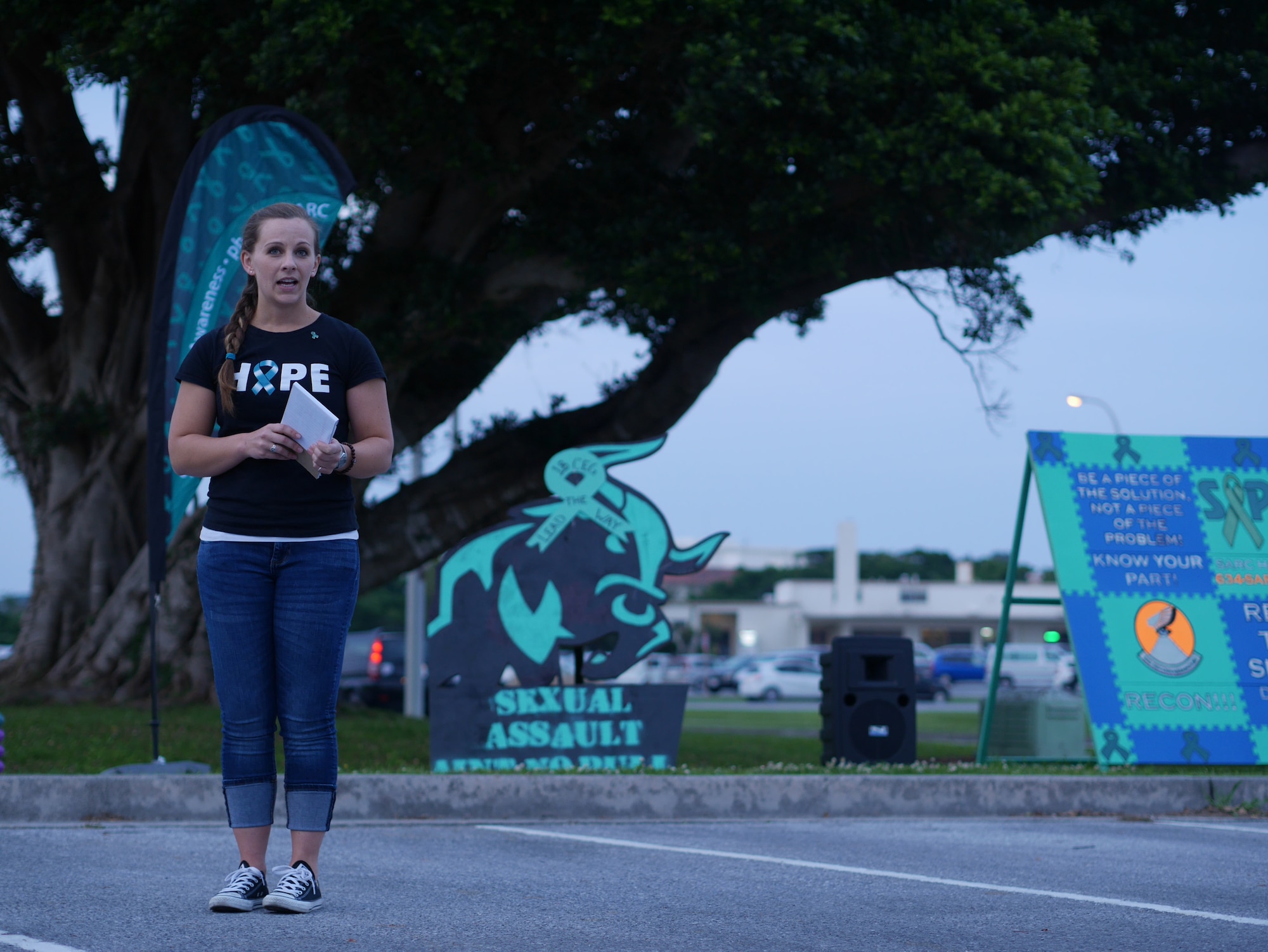 U.S Air Force Captain Elizabeth Belleau, 18th Wing Sexual Assault Prevention Coordinator, talks about the importance of sexual assault prevention during the Take Back the Night march on Kadena Air Base, Japan, May 1, 2015. Take Back the Night is a rally, a march and a time to reflect for the survivors of sexual assault. (U.S. Air Force photo/Senior Airman Omari Bernard)