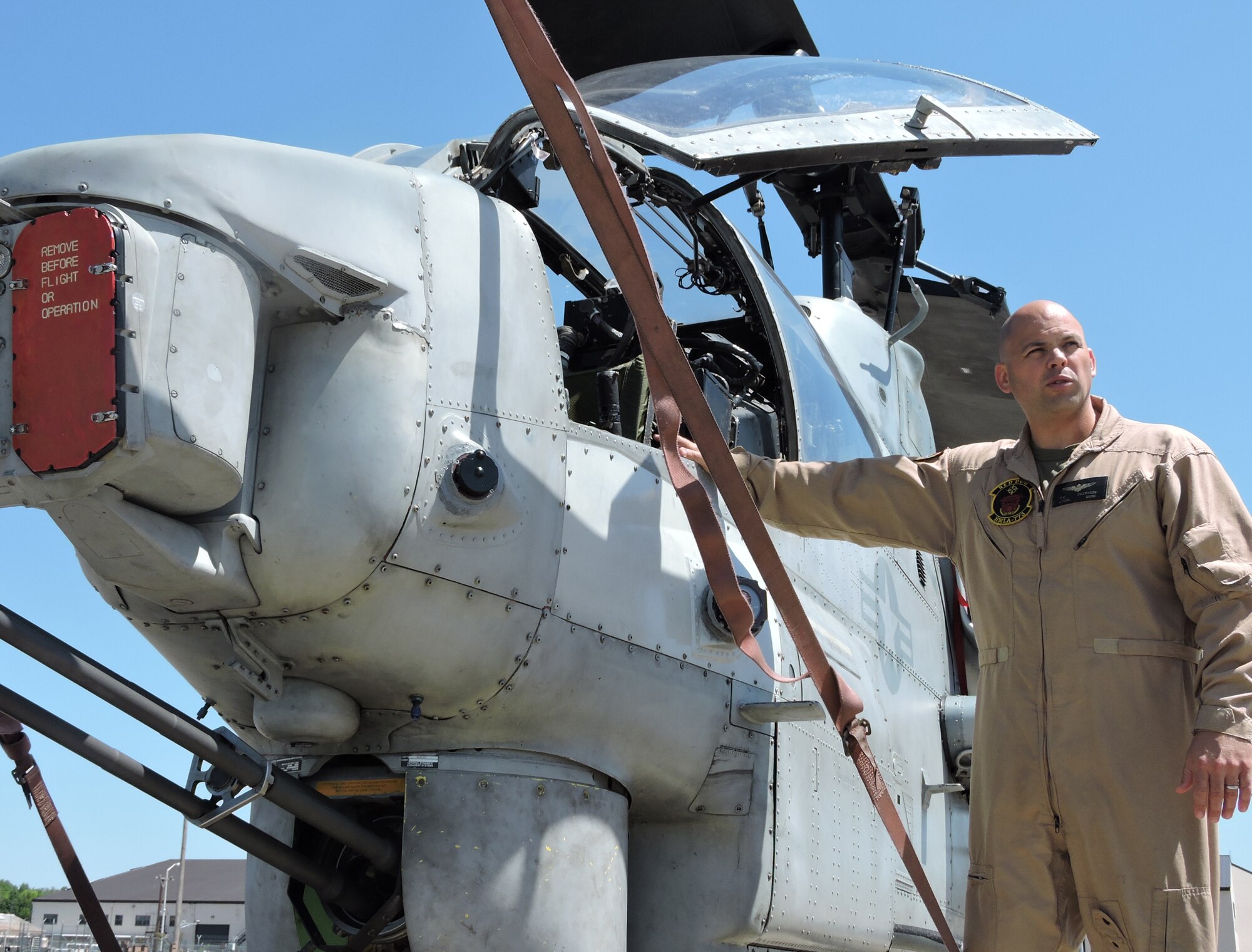 Lt. Col. Philip Eilertson, Marine Aircraft Group 49 Detachment A commanding officer, Discusses the benefits of having more helicopters during an interview with local media April 23, 2015. (U.S. Air Force photo by Roland Leach)
